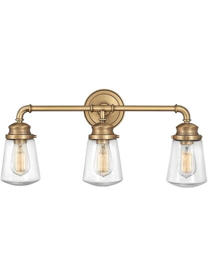 Fritz 3-Light Bath in Heritage Brass.